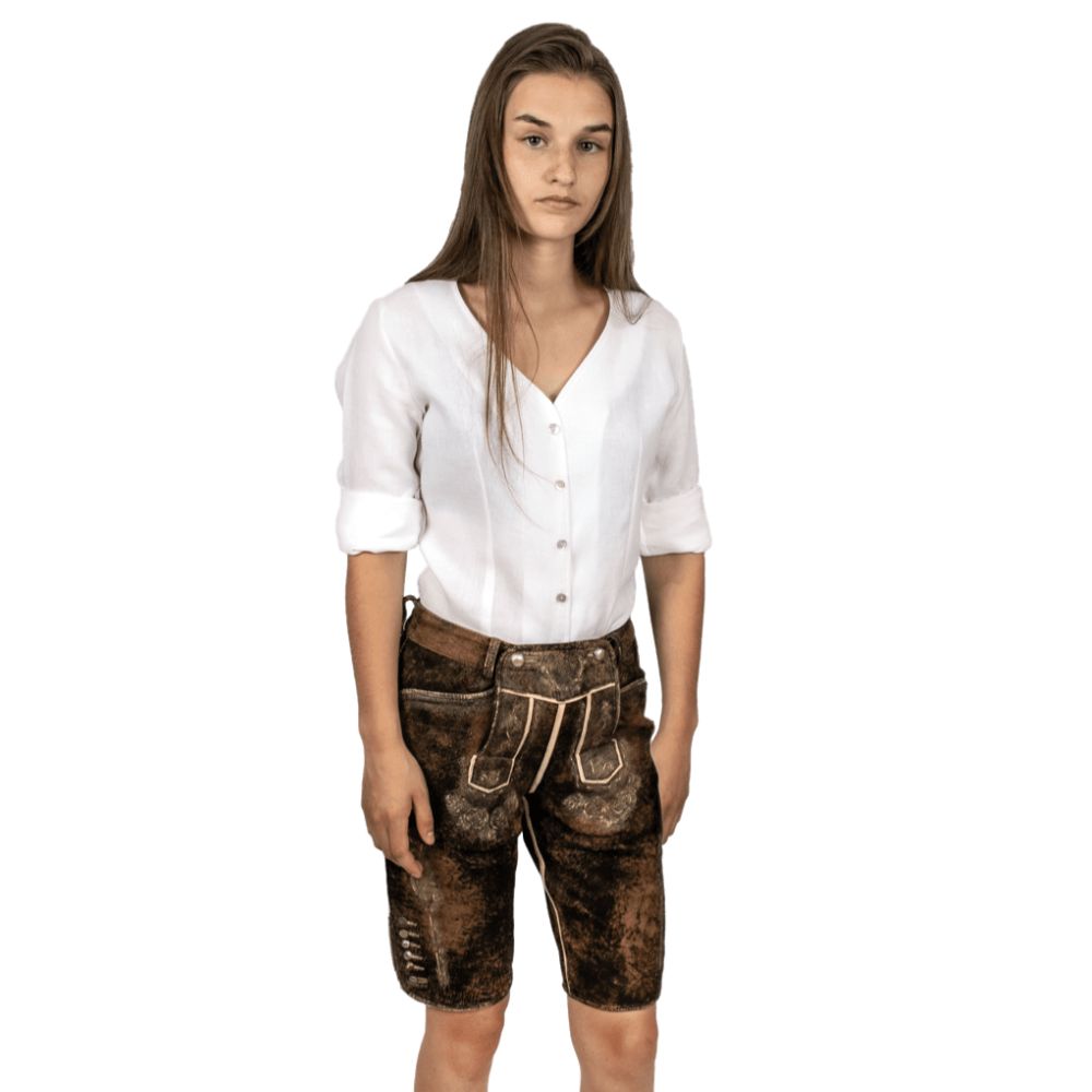 Woman wearing traditional Lederhosen shorts at Oktoberfest festival.